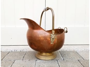 A Brass Coal Scuttle With Delft Porcelain Handle