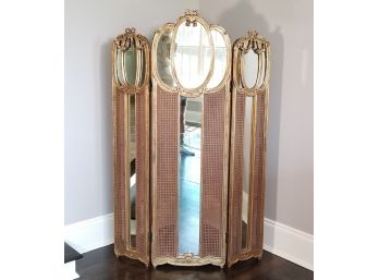 A Late 19th Century French Wood And Gilt Paravent With Inset Cane And Mirrored Panels