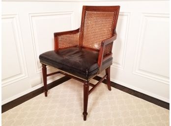 A Vintage Leather Upholstered Cane Arm Chair