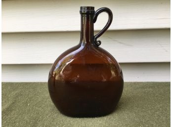 Early Open Pontil Free Blown Chestnut Amber Flask With Applied Handle.