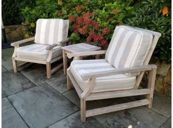 A Pair Of Teak Arm Chairs And A Cocktail Table By Outdoor Classics