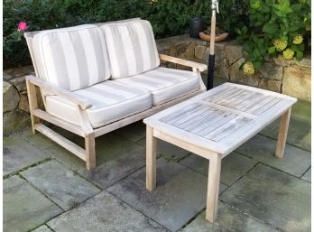 A Teak Loveseat And Coffee Table By Outdoor Classics