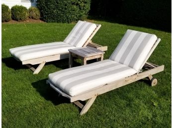 A Pair Of Teak Lounge Chairs And Cocktail Table By Outdoor Classics