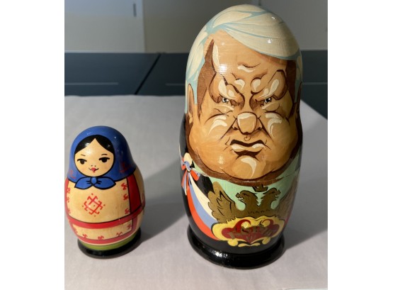 Russian Nesting Dolls With Soviet Leaders Depicted And A Traditional Babushka Set