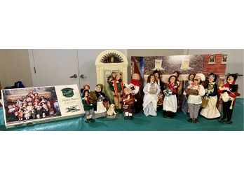 Fifteen Byers' Choice Carolers With Display Risers, Tri-Fold Backdrop Scene And Lighted Holiday Doorway
