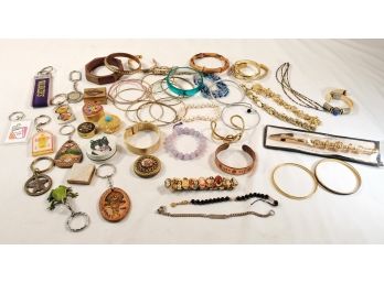 Assortment Of Vintage And Retro Bracelets, Pill Bottles, Estee Lauder Perfume Compact, Key Chains & More