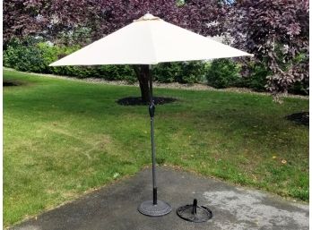 An 8' Market Umbrella And Two Bases