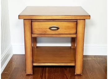 A Polished Pine Nightstand Or Side Table