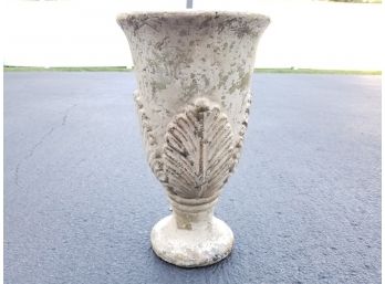A Cast Ceramic Urn