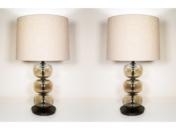 A Pair Of Modern Smoked Glass Lamps With Linen Shades