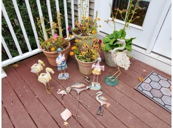 Mixed Lot Of Garden Flamingo Ornaments Including Four Plants In Plastic And Resin Pots