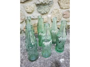 Set Of (9) Vintage Coca Cola Bottles