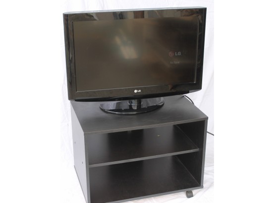 LG 32' Television And Black Tv Stand