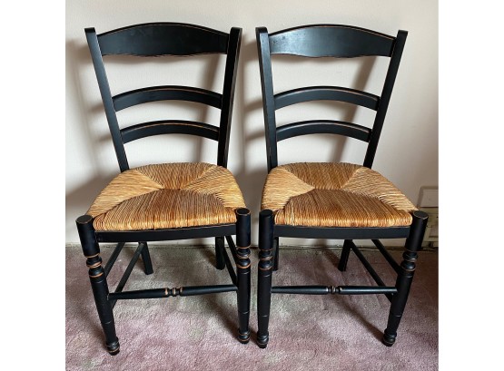 Set Of Distressed Black Wood Chairs With Caned Seats