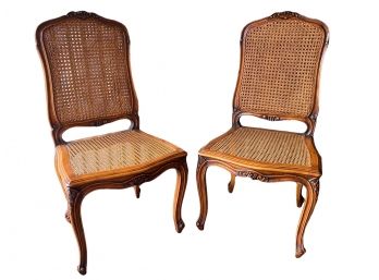 Pair Of French Provincial Style Cane Chairs With Cabriole Legs And Carved Accents