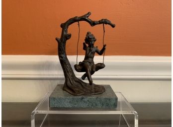 Bronze Of Cherub On Tree Swing On A Marble Plinth
