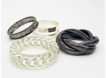 4 Bangles In Mixed Metal Tones Including Lucite