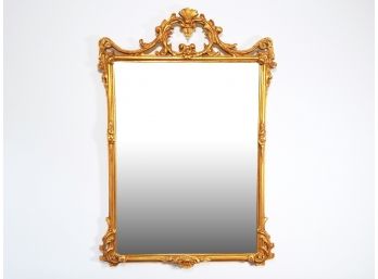 A Carved Gilt Wood Mirror By Freidman Brothers