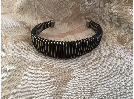 Sophisticated Cuff In Alternating Bands Of Black And Gold Tone - Lot #12