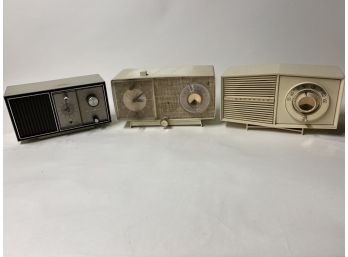 Two General Electric Clock Radios And A Motorola Radio