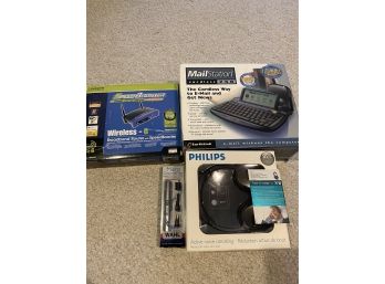 Phillips Headphones New In Box , Router , Wahl Hair Trimmer And Cordless Mailstation