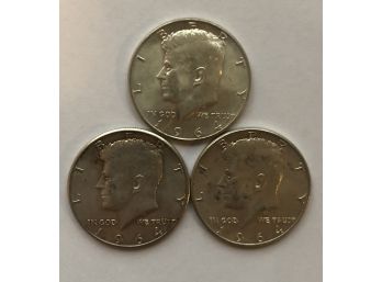 Three 1964 Kennedy Half Dollars