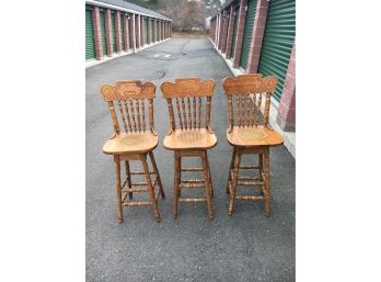 Trio Of Oak Bar Stools In Good Shape With Swivel Tops And Cane Seat