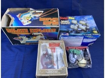 Toy Lot  Galaxy Explorer, Microscope, Snap Tight Ship Model And Pants 2 In A Bag.