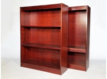 A Pair Of Wood Bookshelves In Cherry Finish