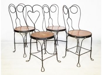 A Grouping Of 4 Vintage Wrought Iron 'Ice Cream' Chairs