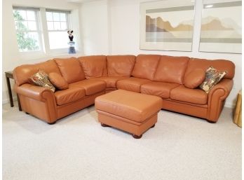 An Elegant Tawny Leather Sectional Sofa And Ottoman By The Leather Center