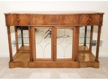 A Hardwood And Mirrored Panel Buffet