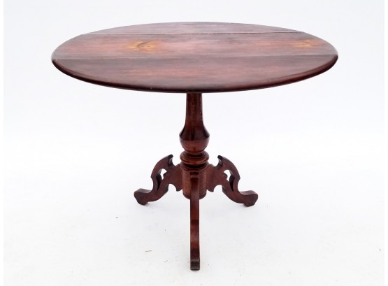 A Victorian Cherry Wood Spindle Base Drop Leaf Table