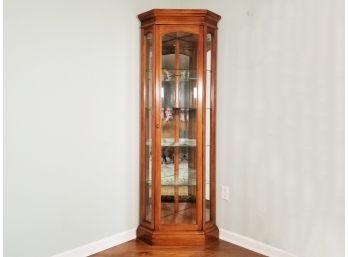 A Lighted Curio Cabinet By American Of Martinsville