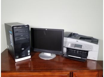 An HP Computer, Monitor, Printer, And Keyboard
