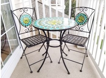 A Wrought Iron And Mosaic Tile Indoor-Outdoor Bistro Set