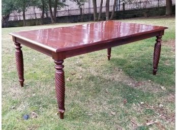 An Extendable Hardwood Dining Table By Ethan Allen