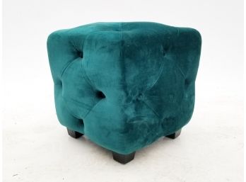 An Upholstered Tufted Ottoman