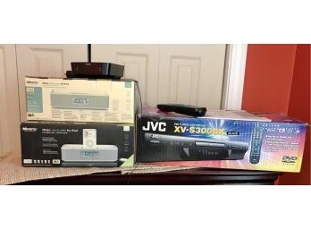 Pair Of Clock Radios And A DVD Player In The Box