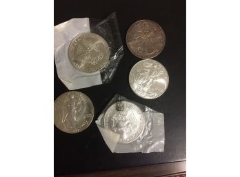 5 American Eagle Silver Dollars 999.