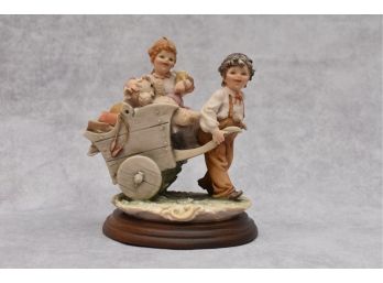 Florence 1983 Signed B. Merli Figurine 'Boy Pulling Girl In Cart'