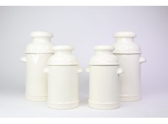 Four Porcelain Milk Can Canisters