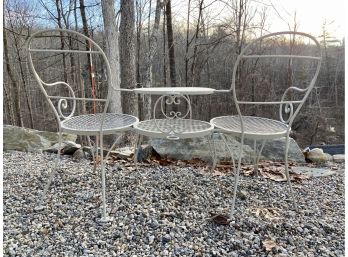 Wrought Iron Loveseat Connected By Round, Two Tier Center Table.