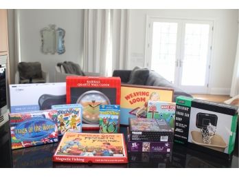 Large Assorted Lot Of  Games, Puzzles, Baseball Clock, And Heating Massager.