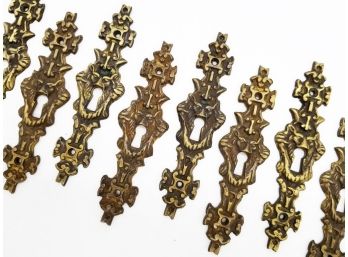 A Set Of Antique Bronze 'Faccia' Motif Keyhole Covers