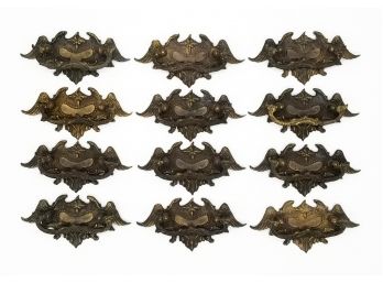 A Set Of 12 Victorian Bronze 'Winged' Handles