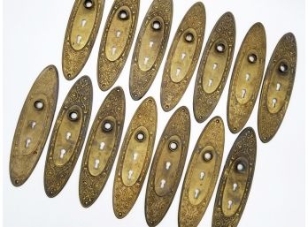 A Large Set Of Oblong, Scrolled Antique Bronze Backplates
