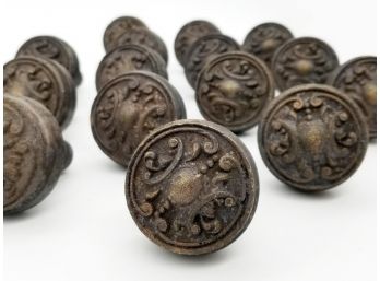 A Large Set Of Antique Bronze Scrolled Doorknobs
