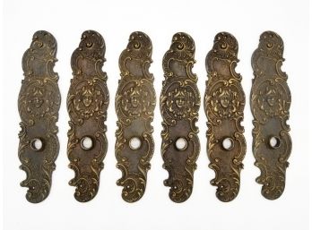 A Set Of Antique Bronze 'Faccia' Motif Backplates