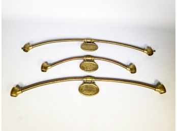 A Group Of Vintage Brass Victoria's Secret Display Headers